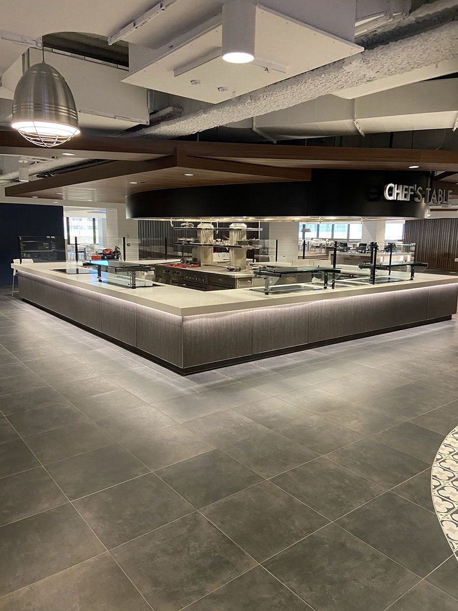 There is a large counter in the middle of the room