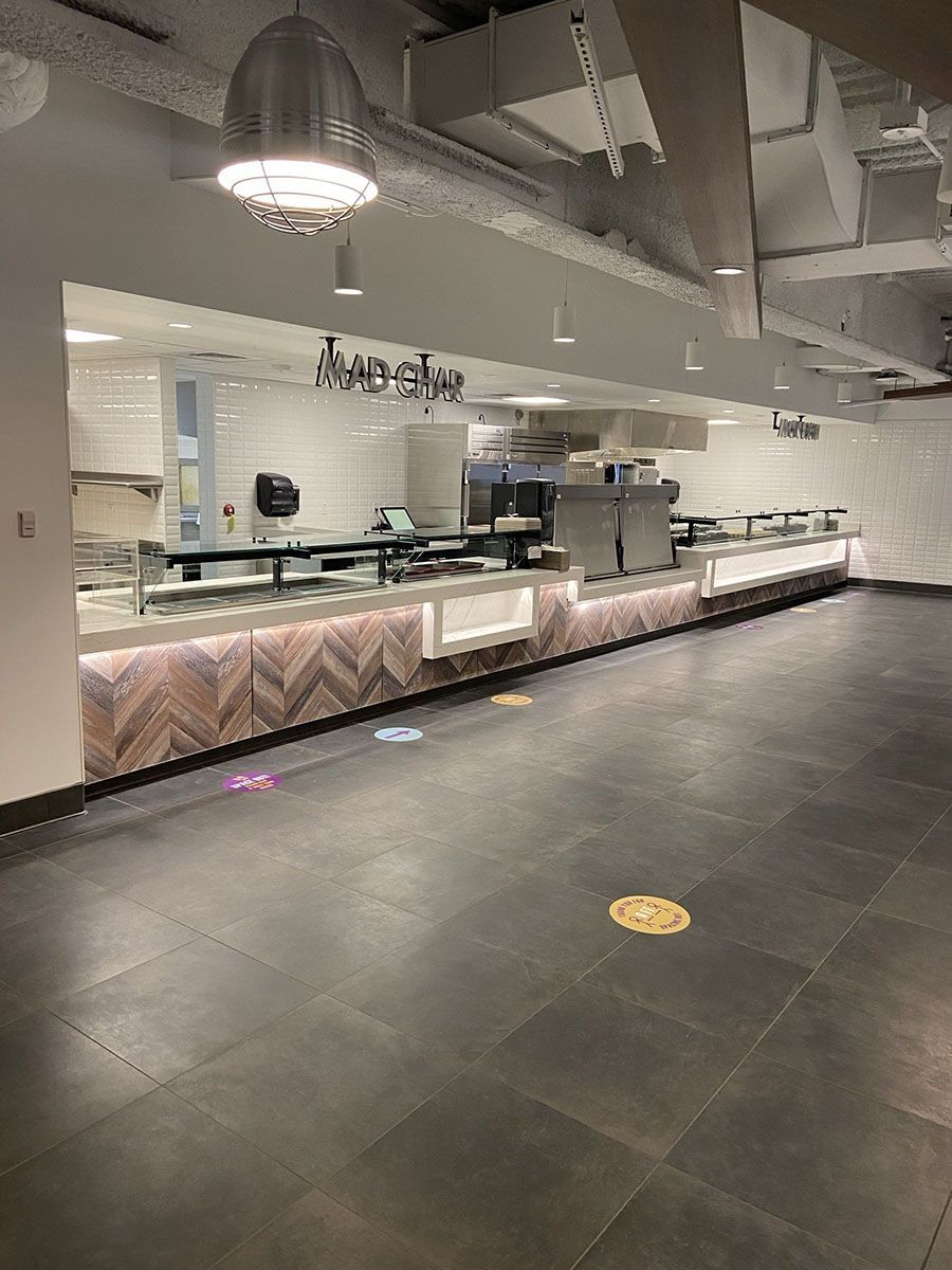 A large room with a counter in the middle of it