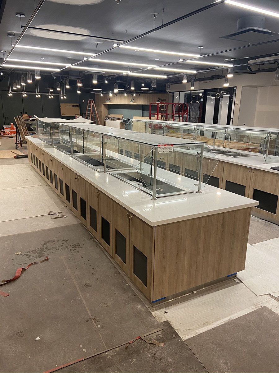 A spacious room with a lot of counters in it