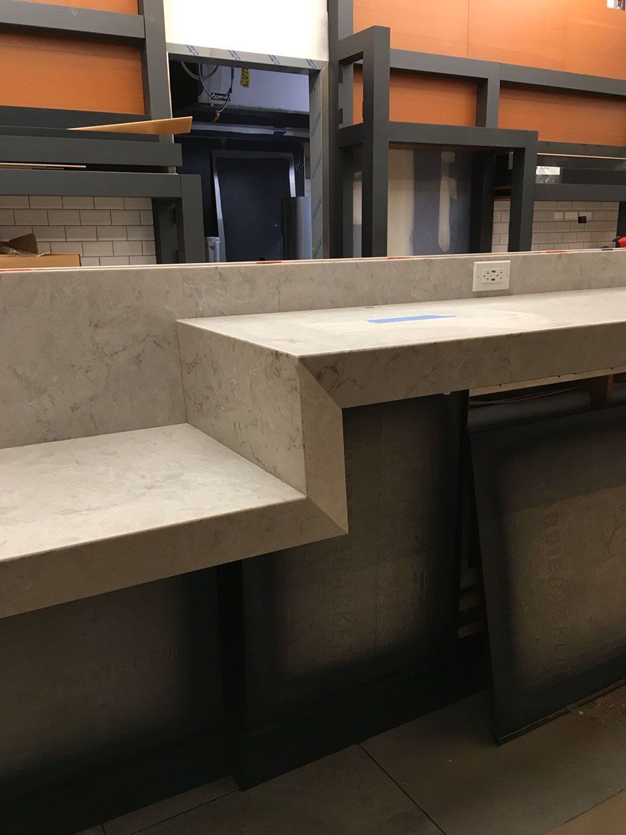 A counter in a restaurant with a beautiful countertop