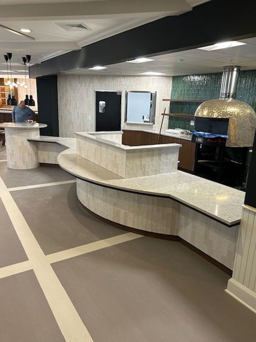 There is an oven in the middle of the room