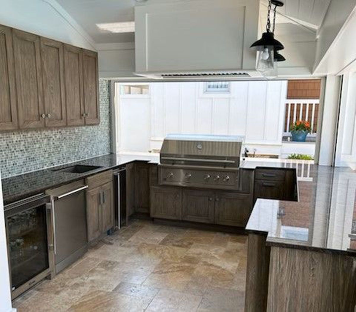 A kitchen with stainless steel appliances and granite countertops