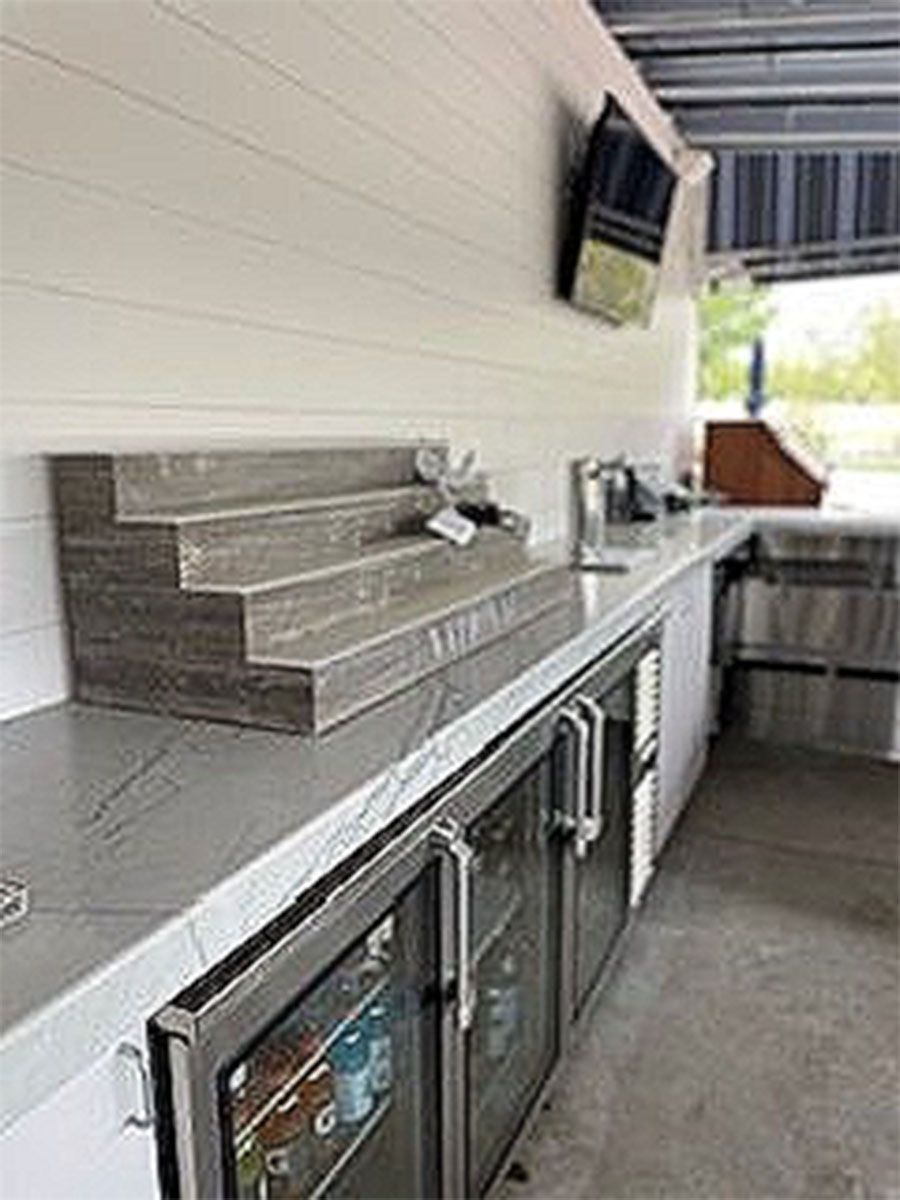 A kitchen with a refrigerator