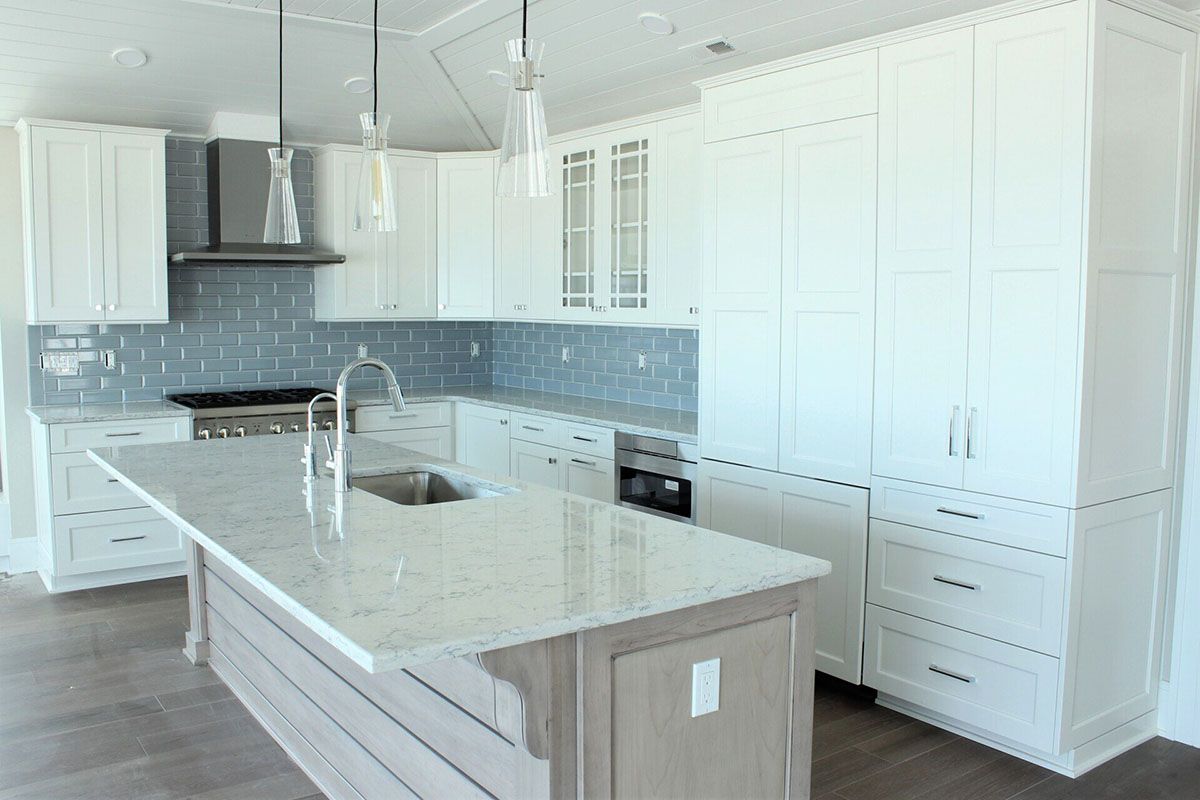 There is a large island in the middle of the kitchen