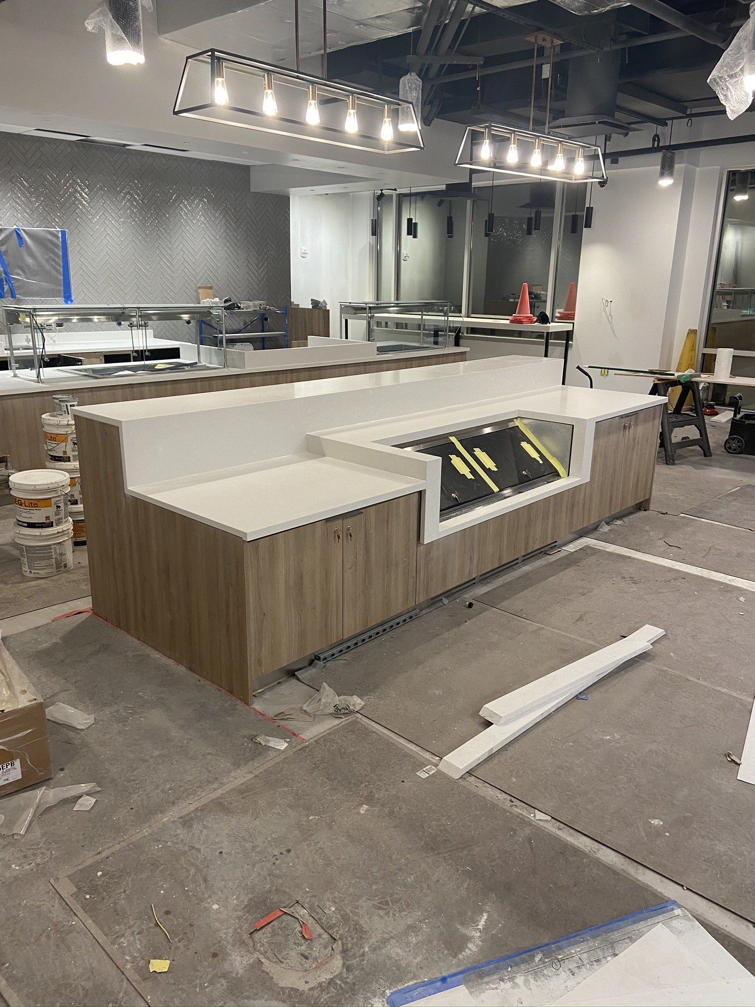 A large room with a lot of furniture in it is being built.