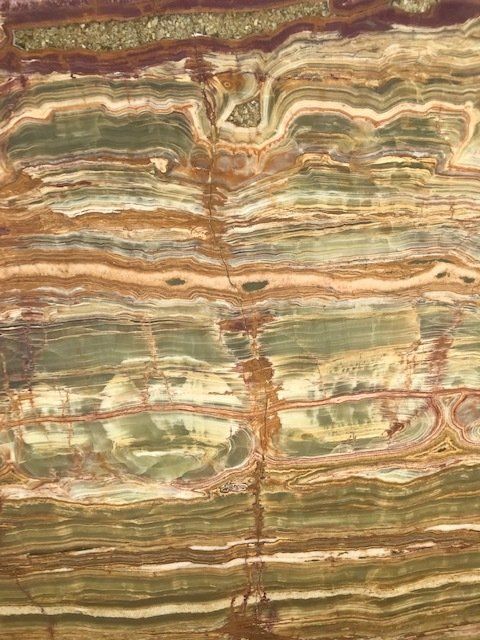 A close up of a marble slab with a striped pattern.
