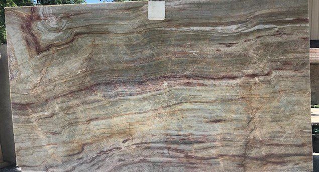 A large piece of granite is sitting on top of a wooden table.