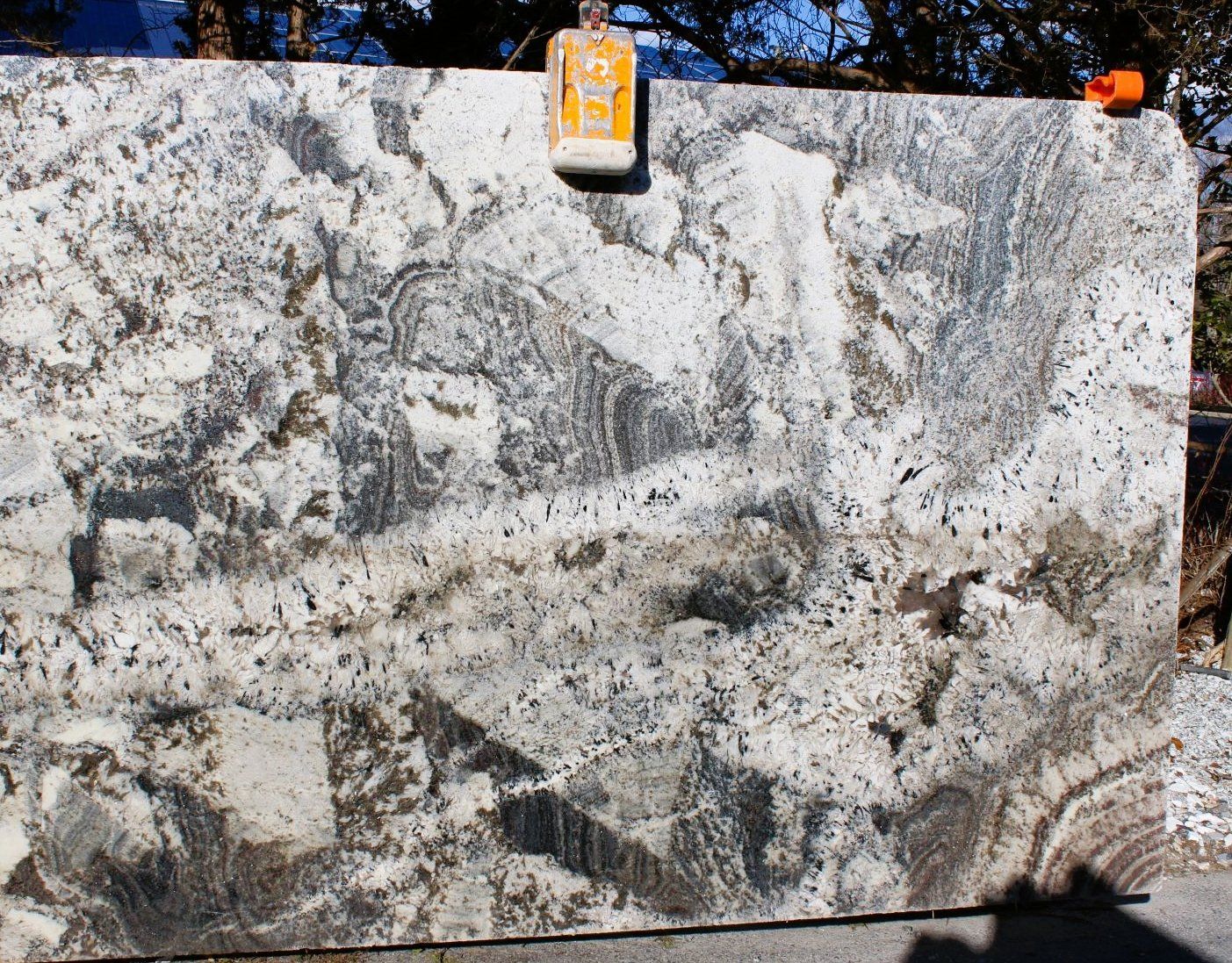 A large slab of granite with a tag on it