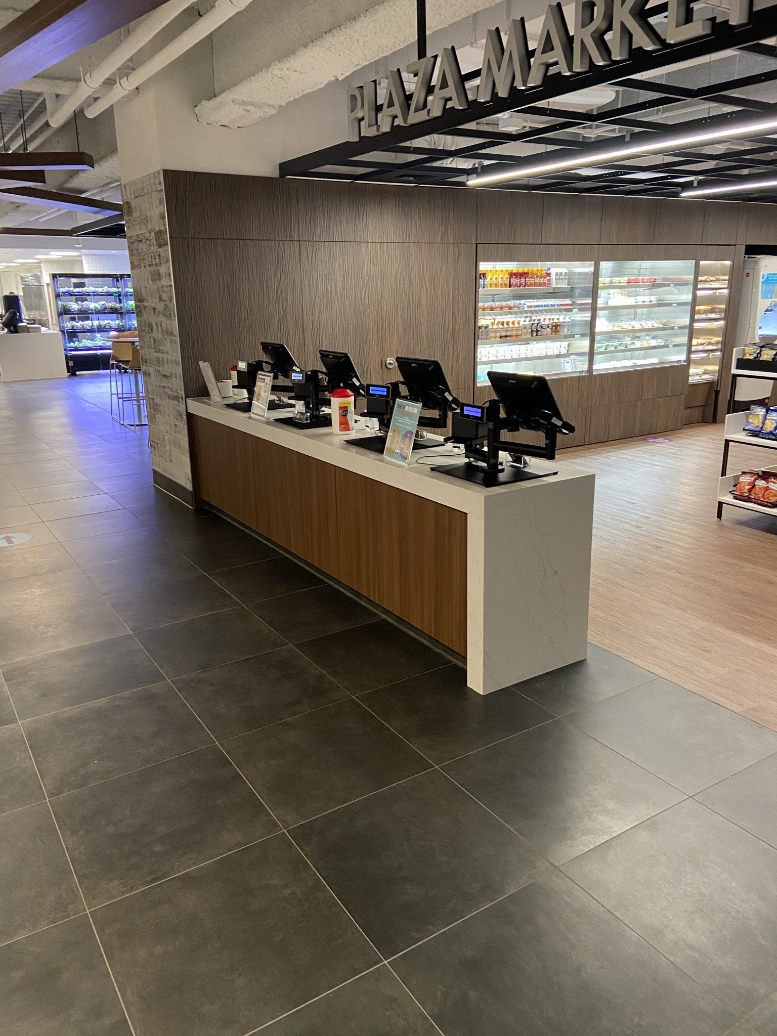 A counter in a store with a lot of computers on it.