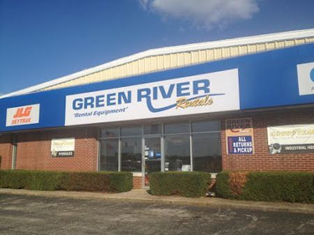 A building with a sign that says green river rentals