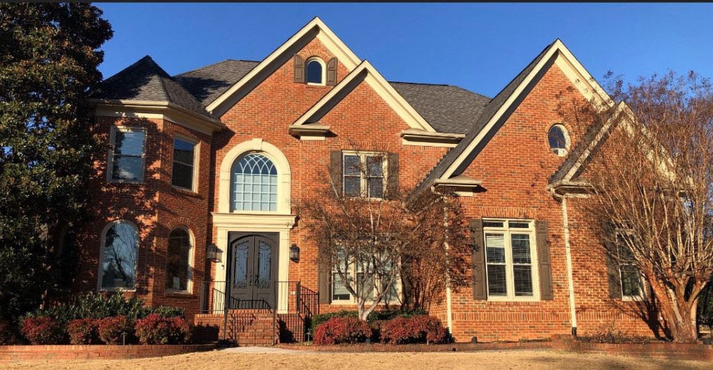 A large brick house with a lot of windows