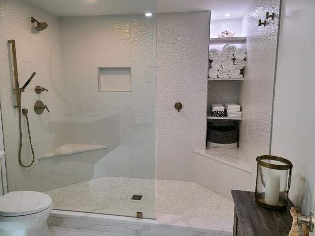 Remodeled bathroom with a walk-in shower and a toilet