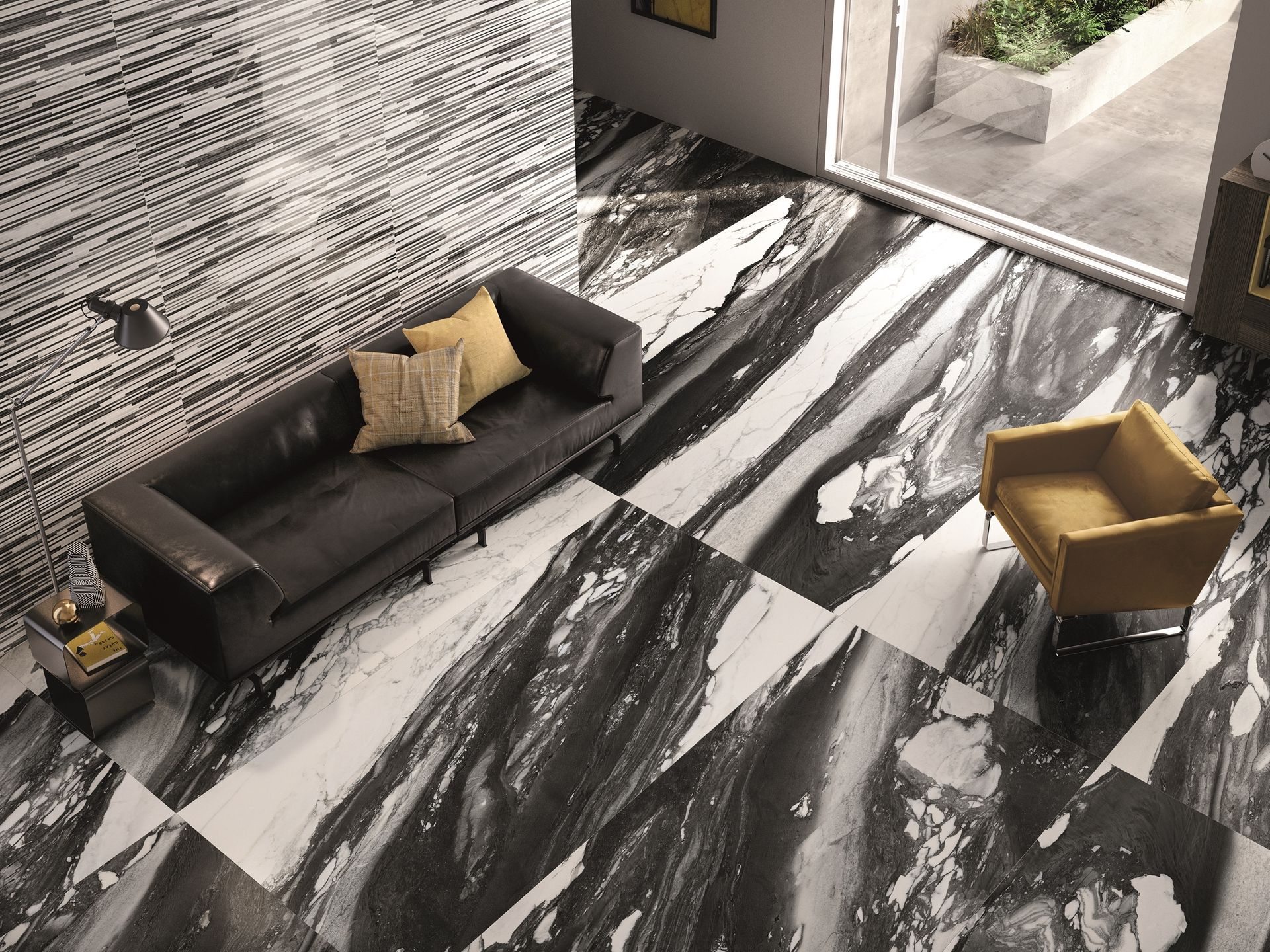 Modern living room with black sofa, gold chair, and black-and-white marble floor