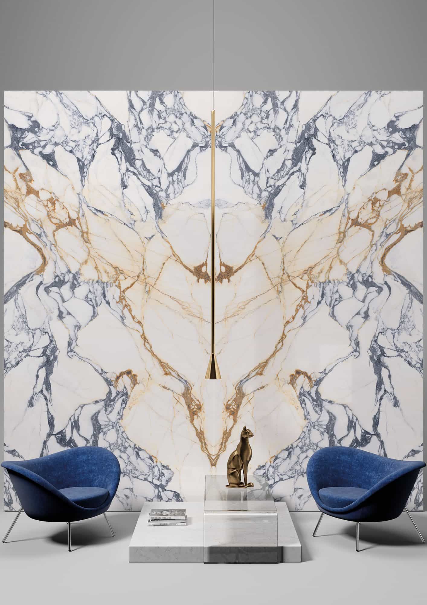 Modern living room with blue chairs, marble wall panels, and a low white table