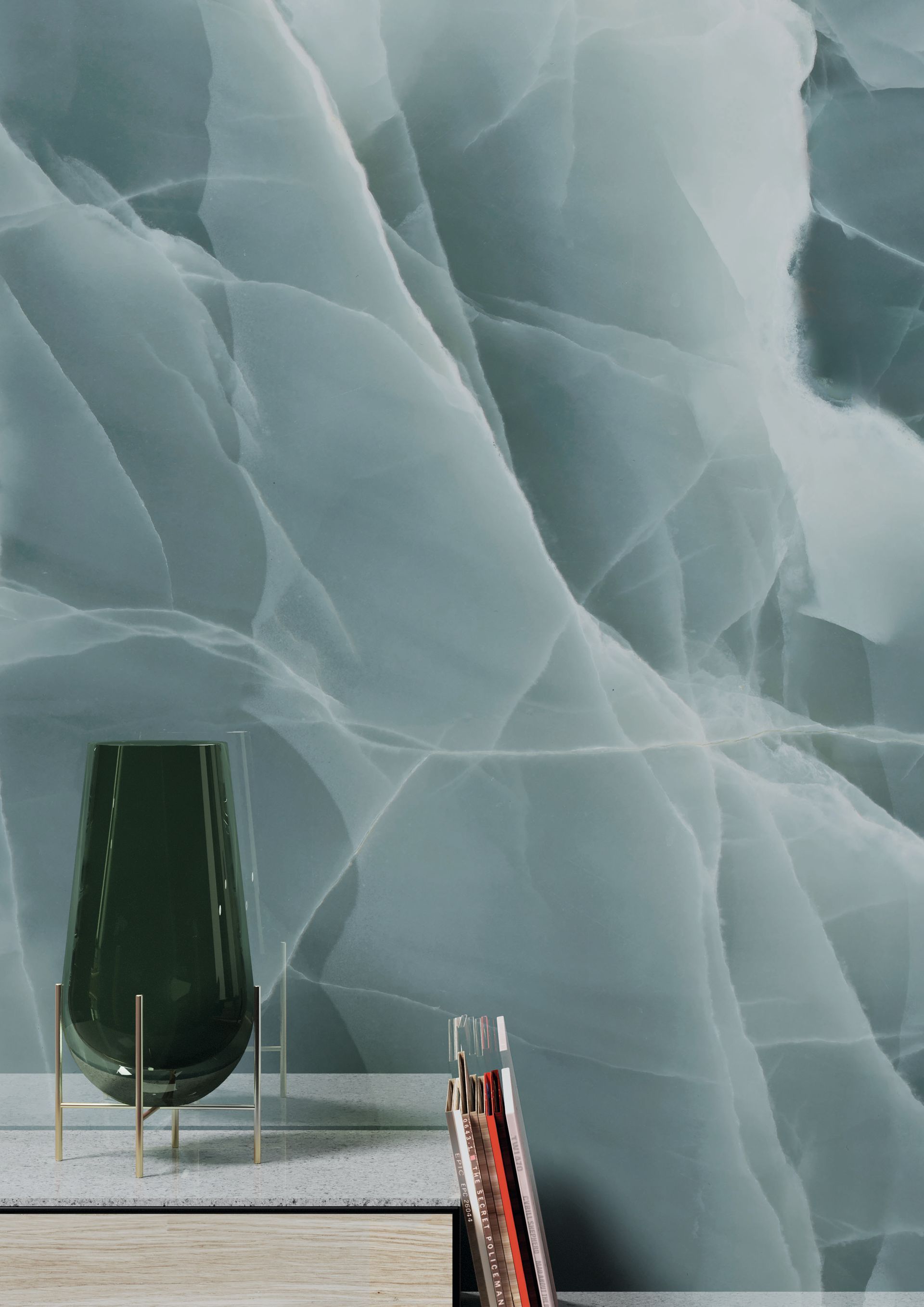 Green chair and red-handled broom against a blue-gray icy textured wall.