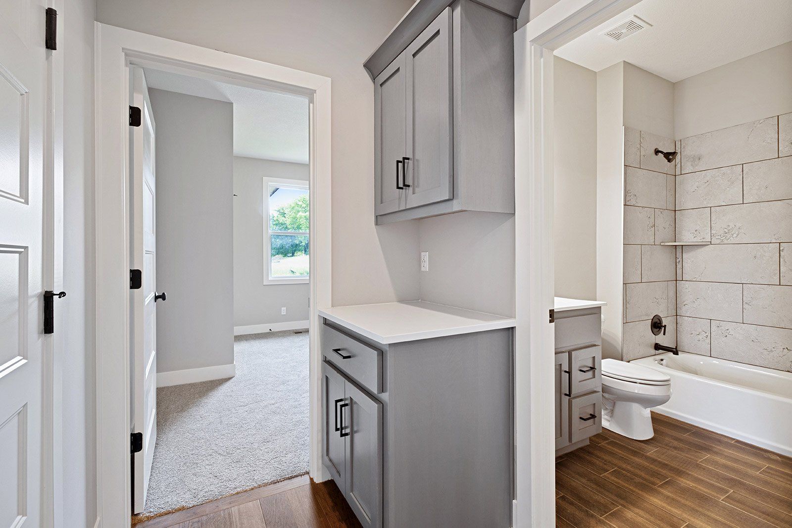 A bathroom with a sink , toilet , and bathtub.