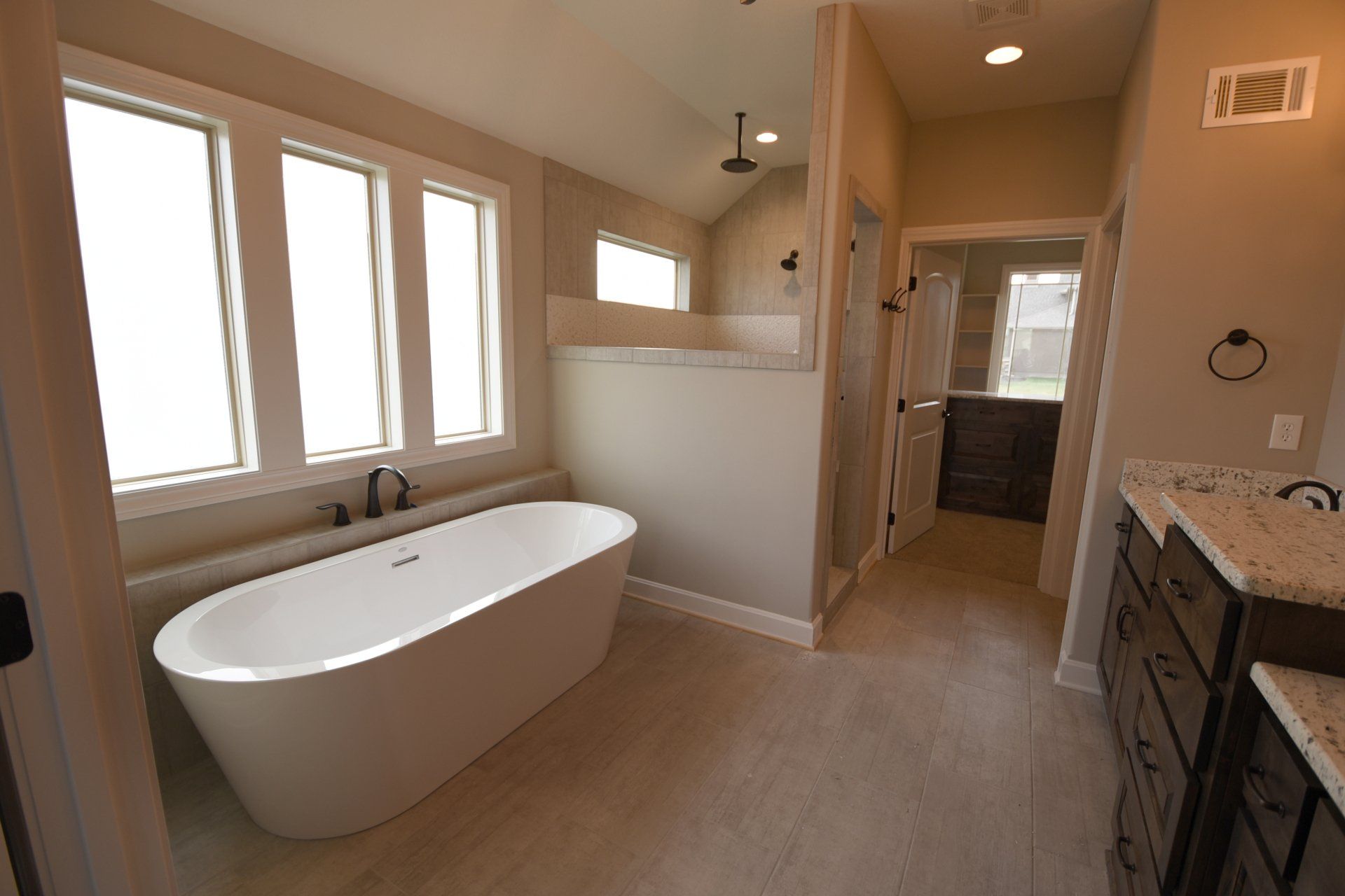 There is a bathtub in the middle of the bathroom.