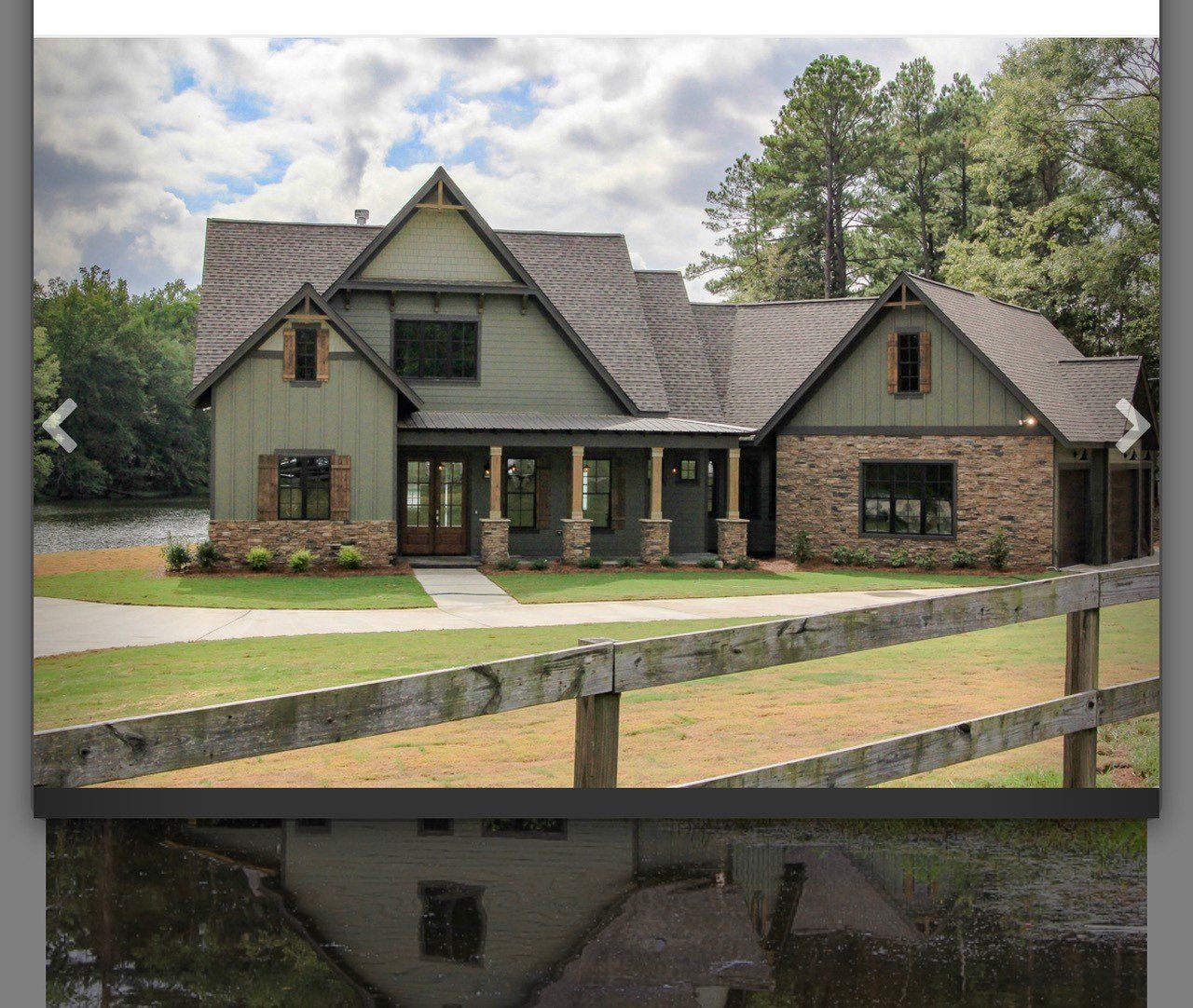 A large house with a wooden fence in front of it
