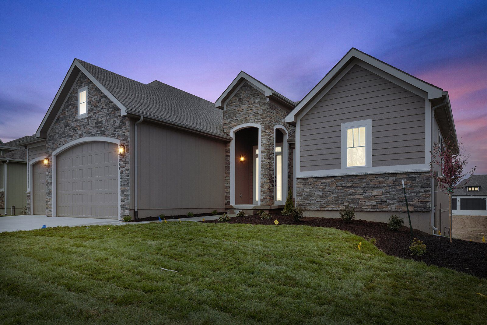 A large house with a lot of grass in front of it