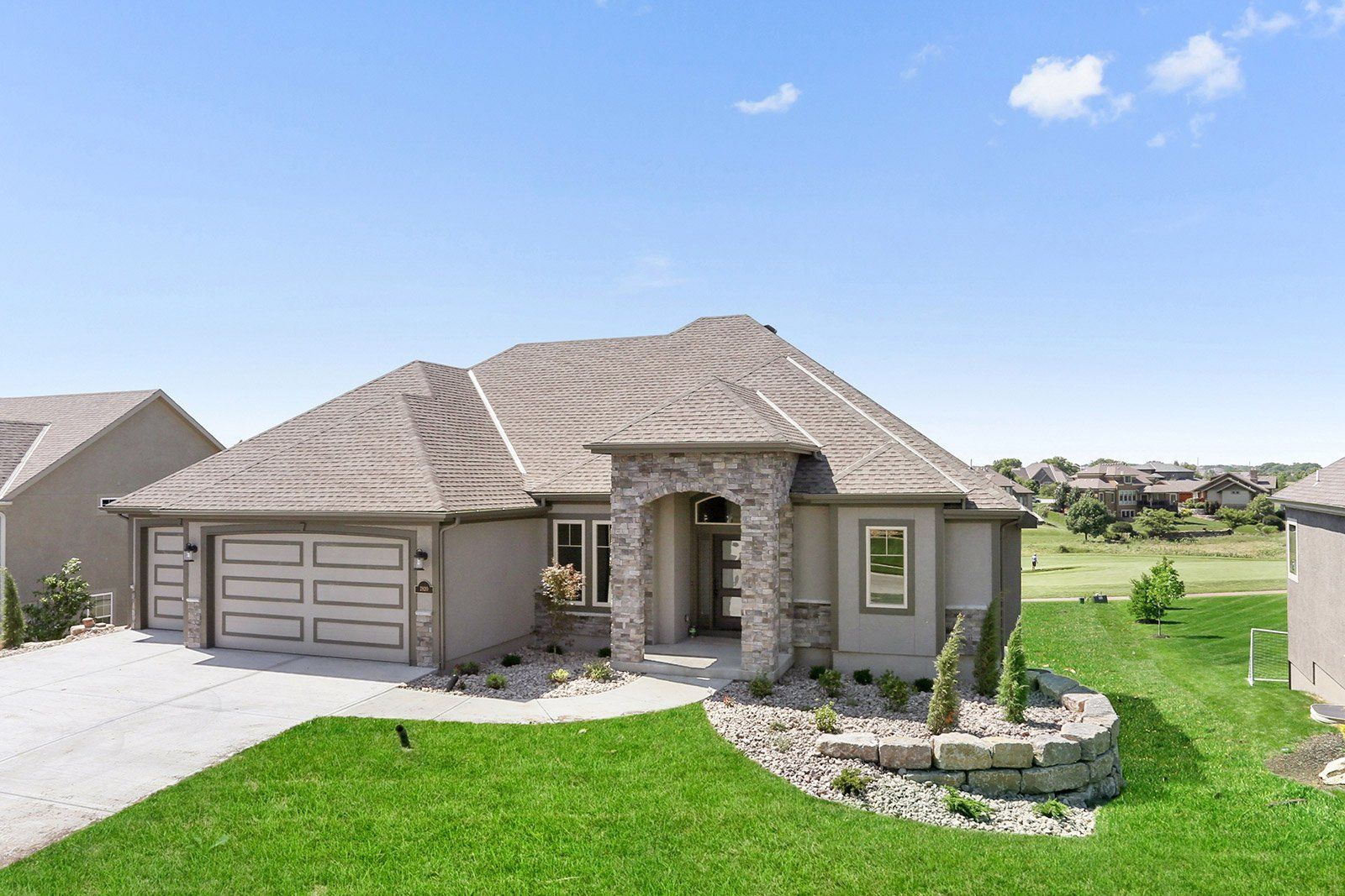 A large house with a lot of grass in front of it.