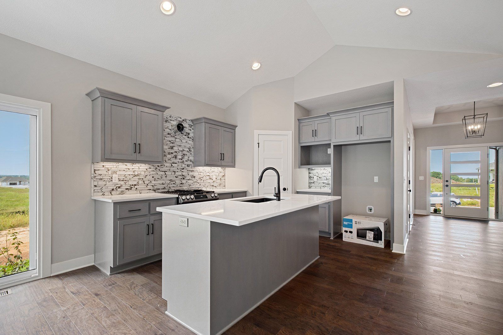 A kitchen with a large island in the middle of the room.