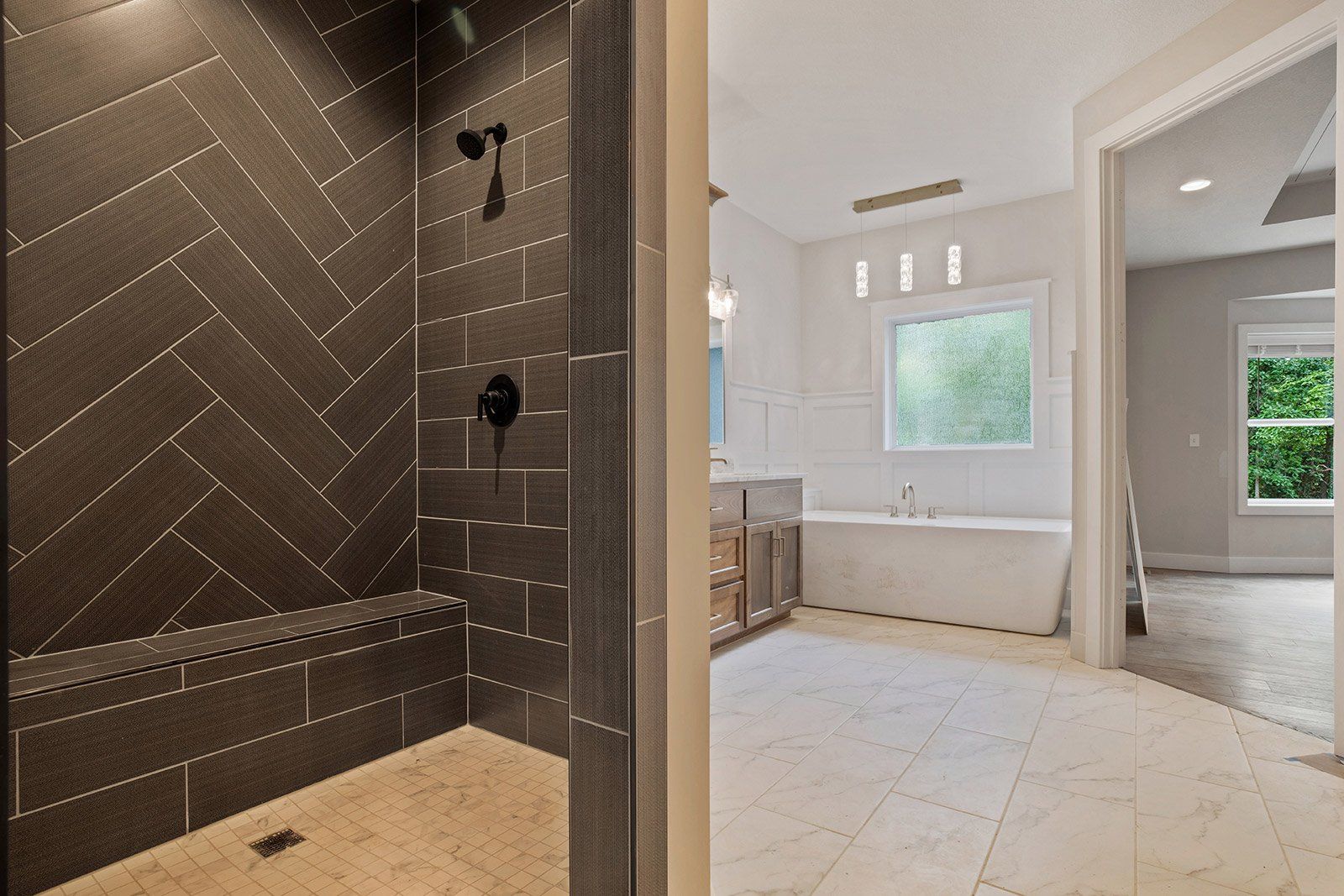 A bathroom with a walk in shower and a bathtub.