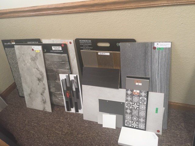 A bunch of tiles are sitting on the floor