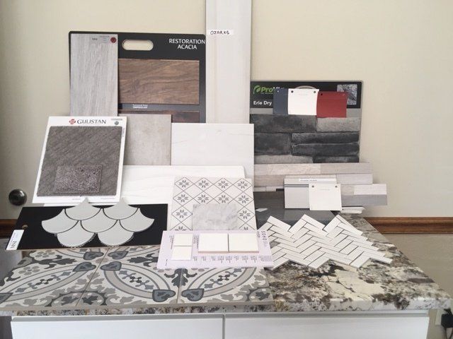 A table with a bunch of tiles and papers on it