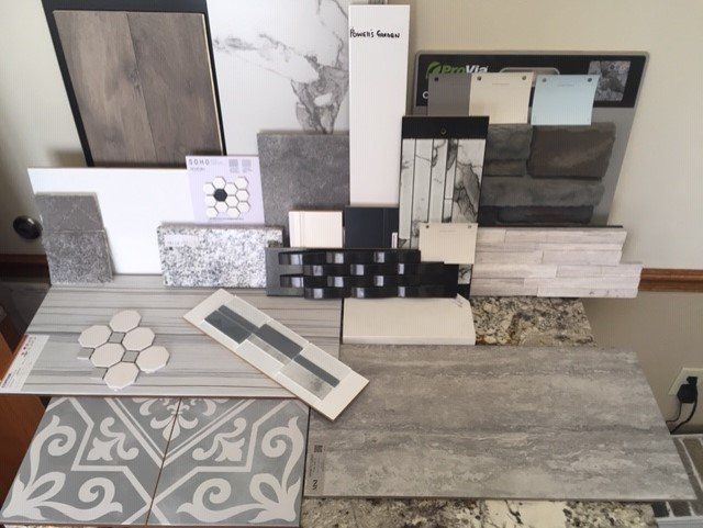 A variety of tiles are displayed on a table