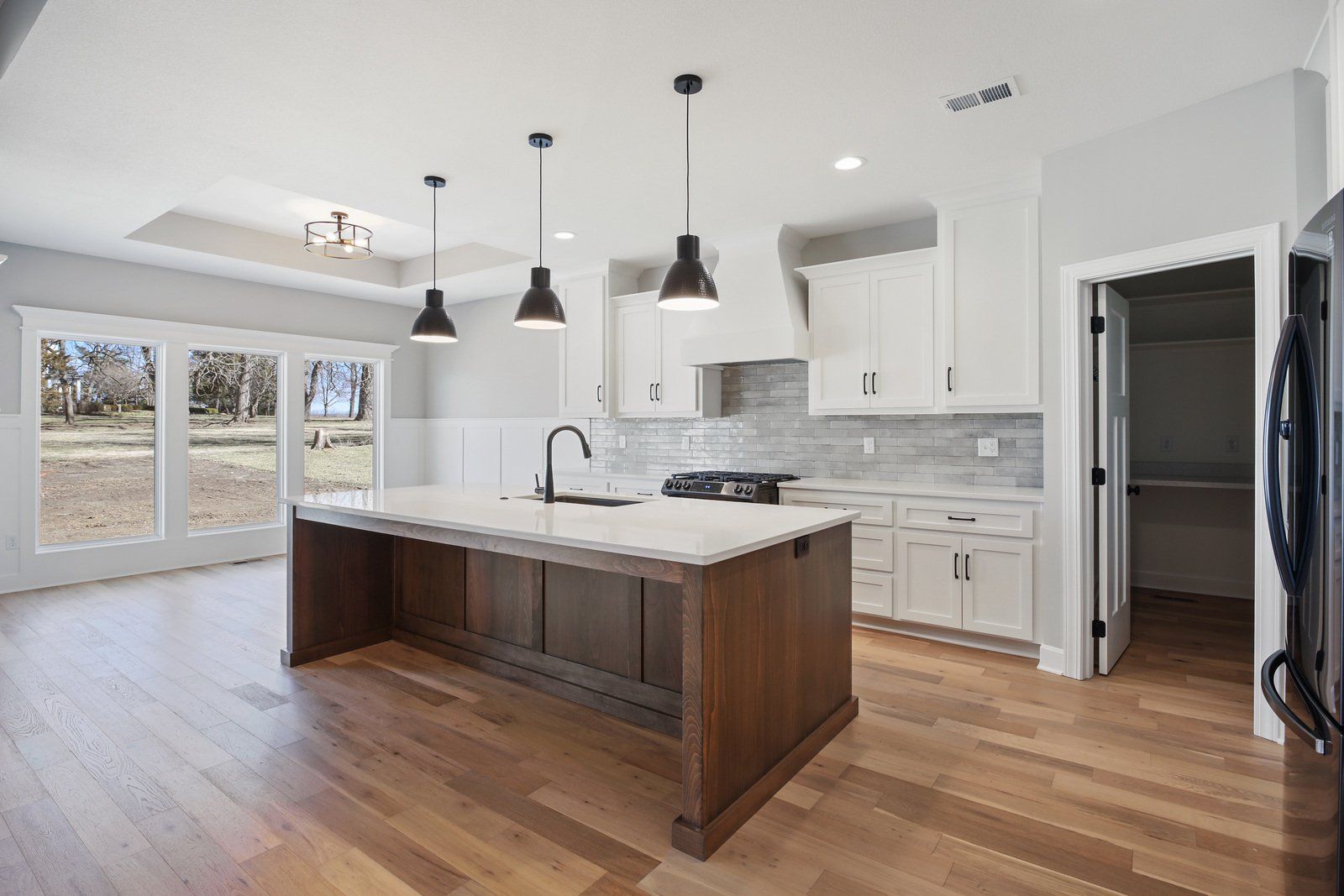 There is a large island in the middle of the kitchen.