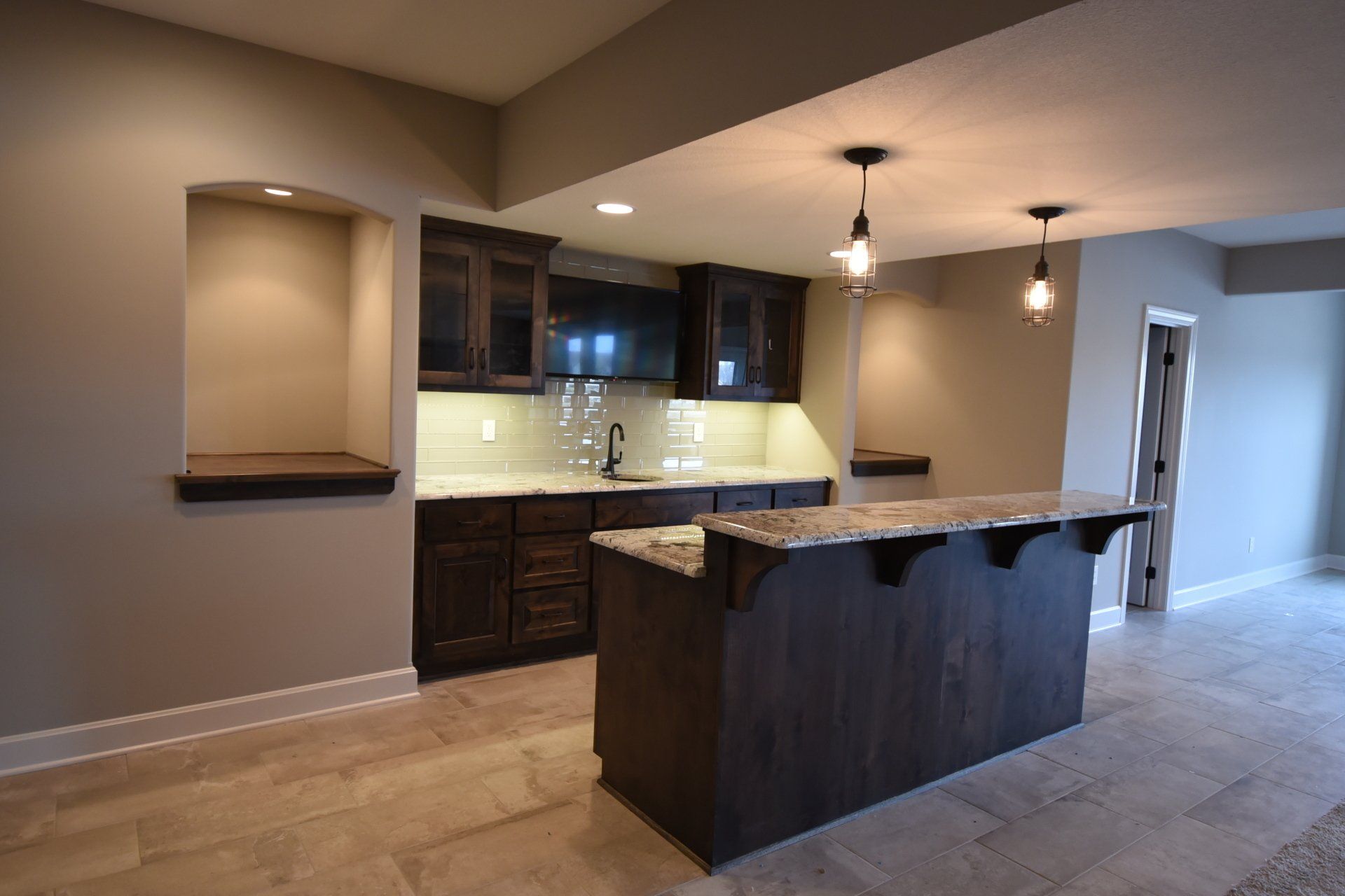 A kitchen with a large island in the middle of the room.