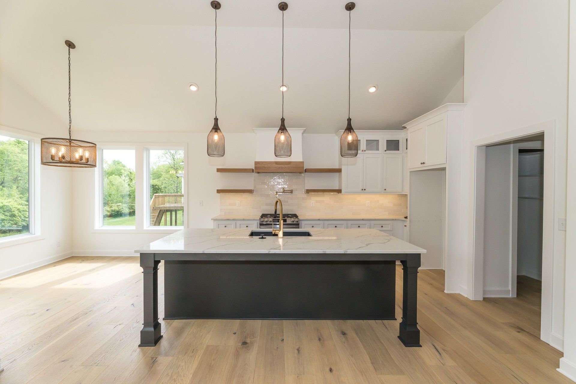 There is a large island in the middle of the kitchen.