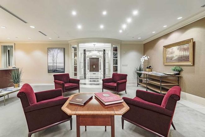 A living room with a table and chairs in it
