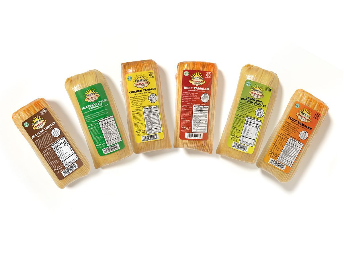 Six colorful packaged snack bars fanned out on a white background
