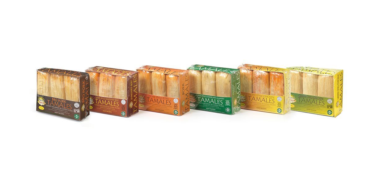 Row of colorful decorative wooden lanterns in brown, orange, green, yellow, and white