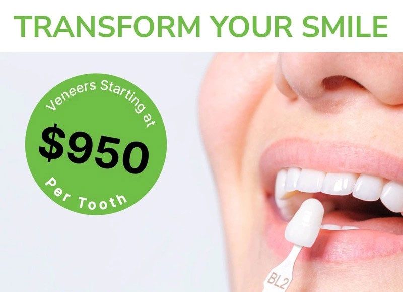 Dental whitening ad: “Transform Your Smile,” with veneers starting at $950 and a person applying whitening treatment to teeth.