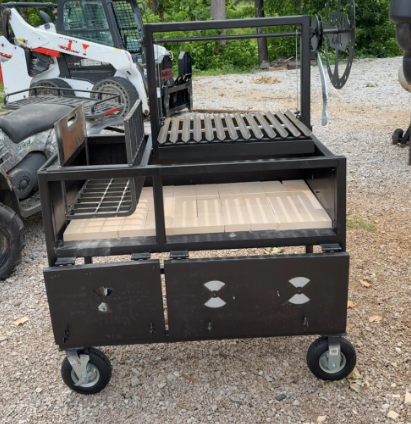 Black metal grilling station on wheels with a grill, smoker box, and fire bricks.