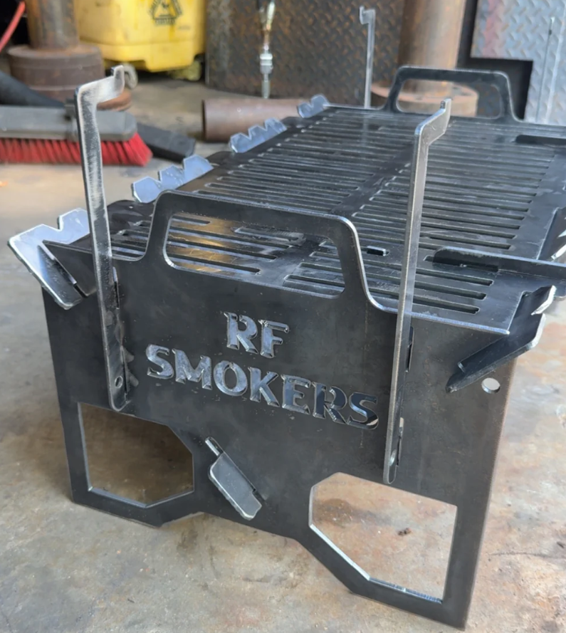 Metal RF Smokers portable grill with handles and grate.