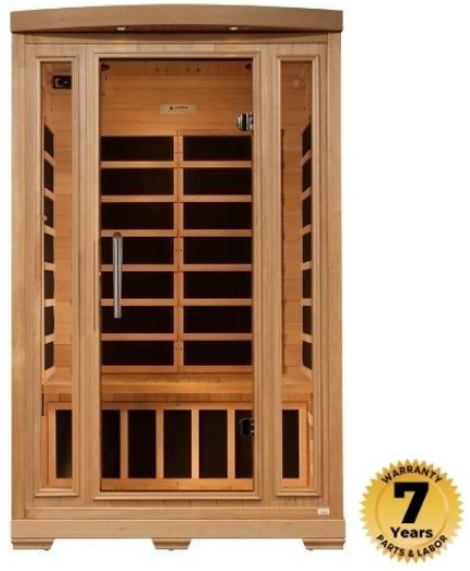 Wooden infrared sauna with glass door and 7-year warranty badge.