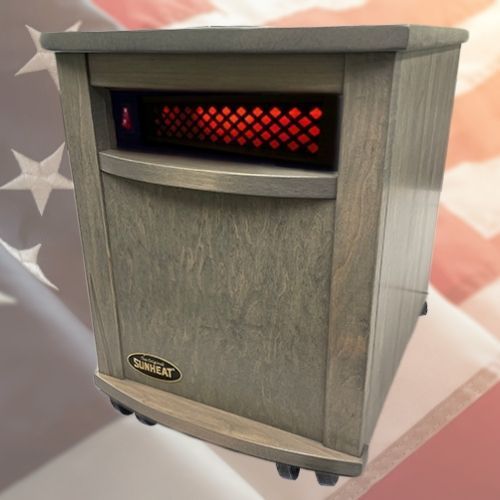 Gray electric space heater with glowing red coils on a US flag background.