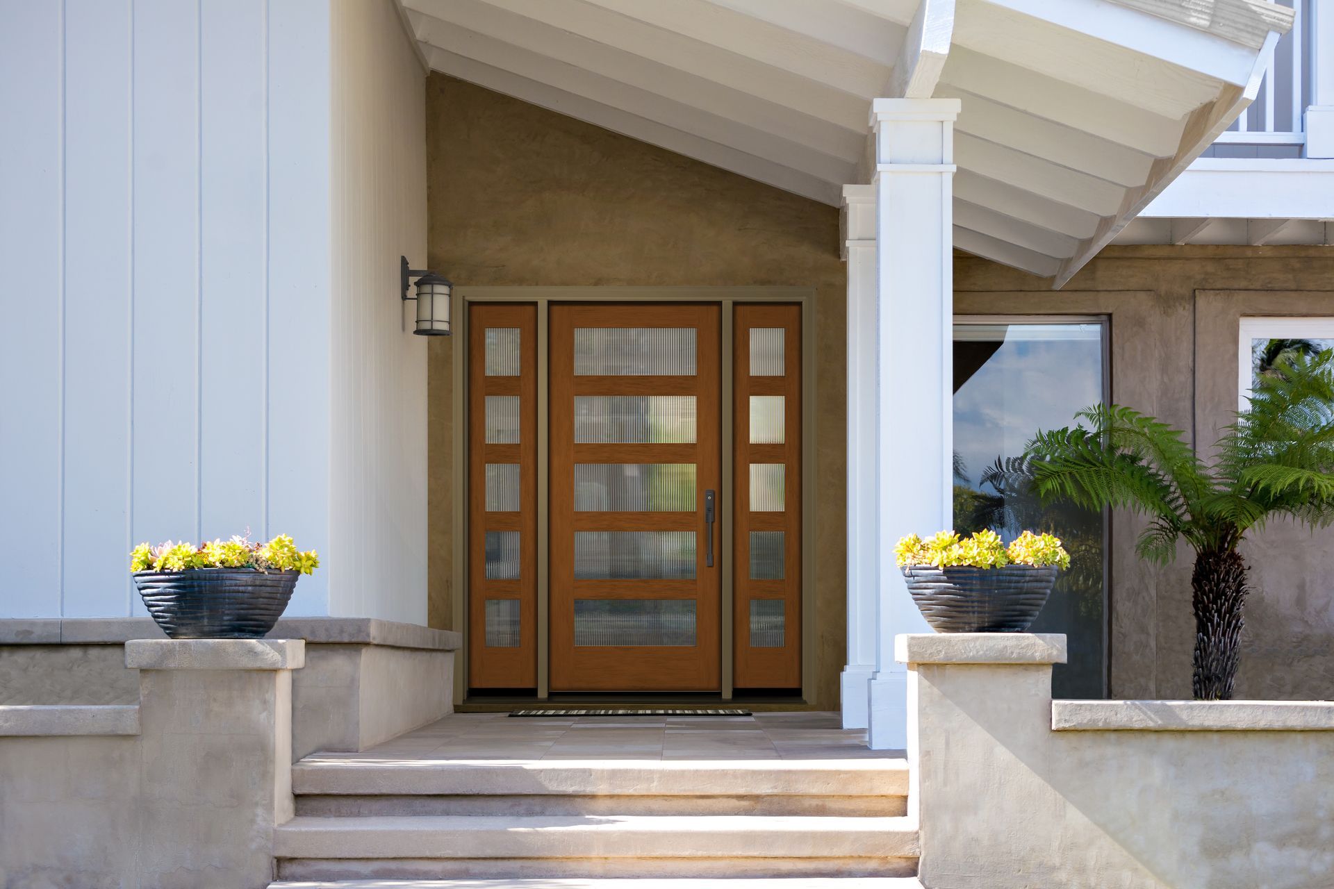 A house with a wooden door and a white roof