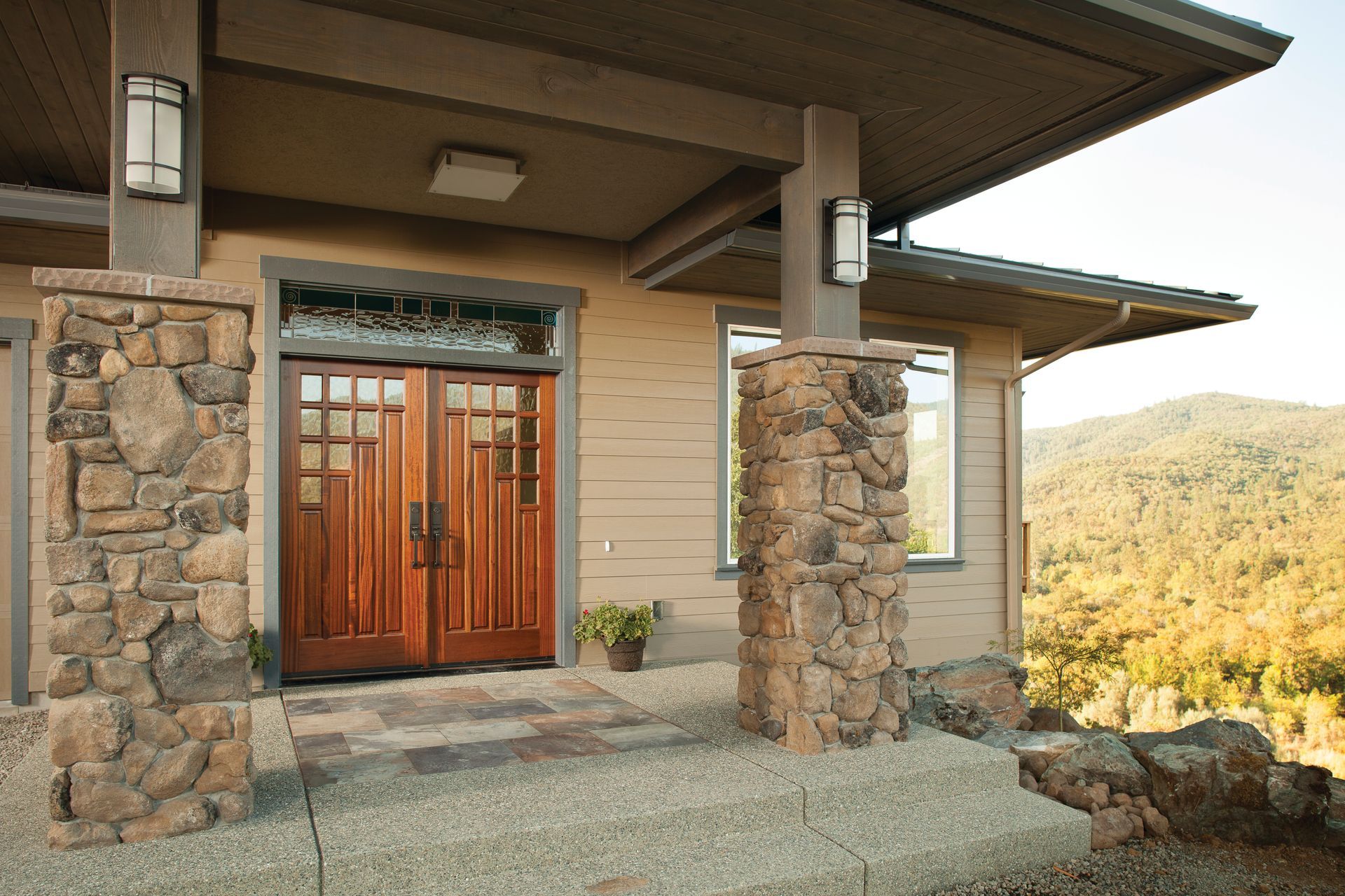 A house with a stone pillar and a wooden door