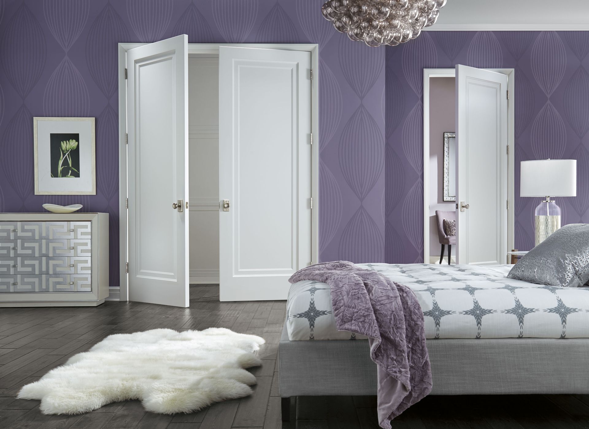 A bedroom with purple walls and white doors