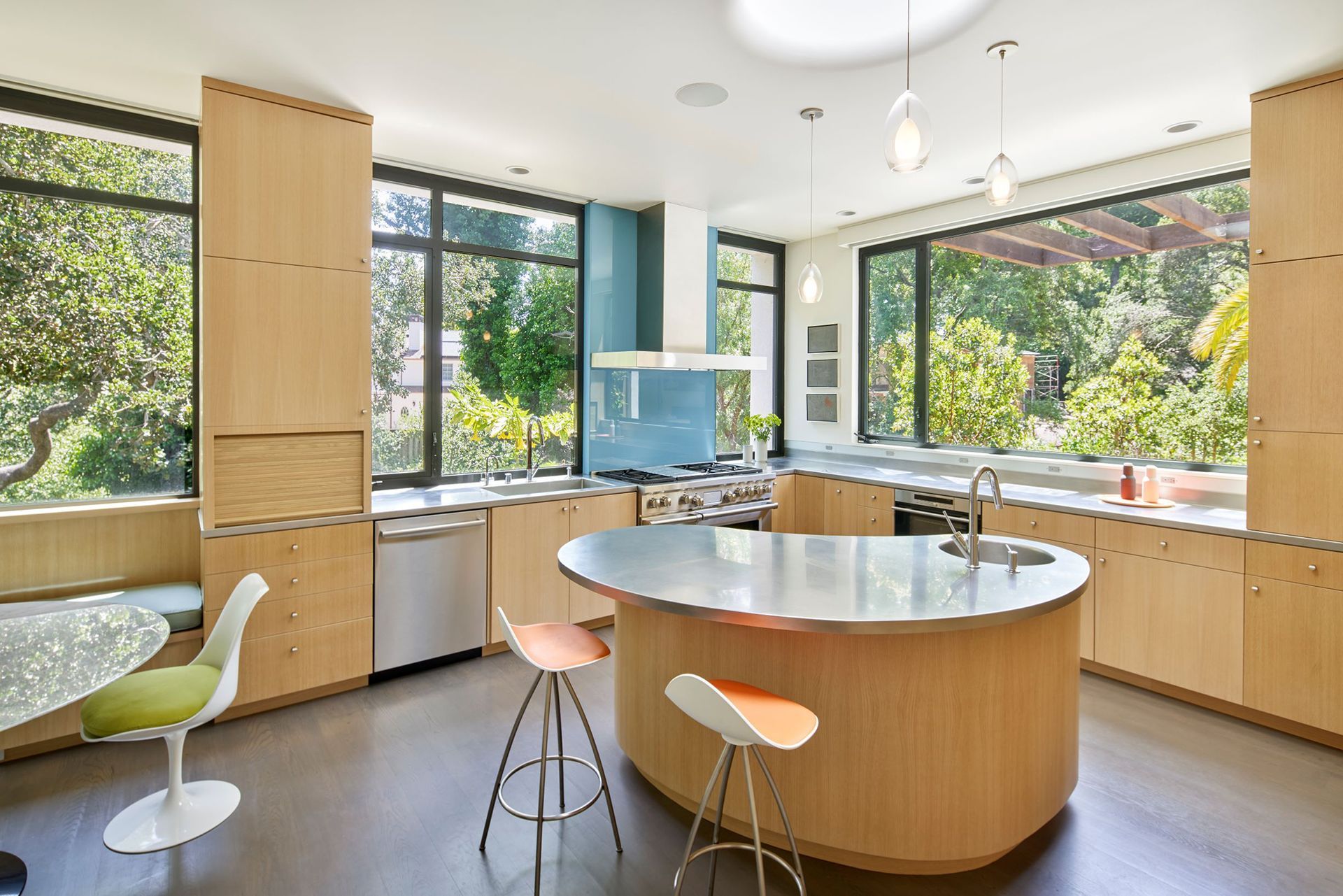 A kitchen with a large island and stools