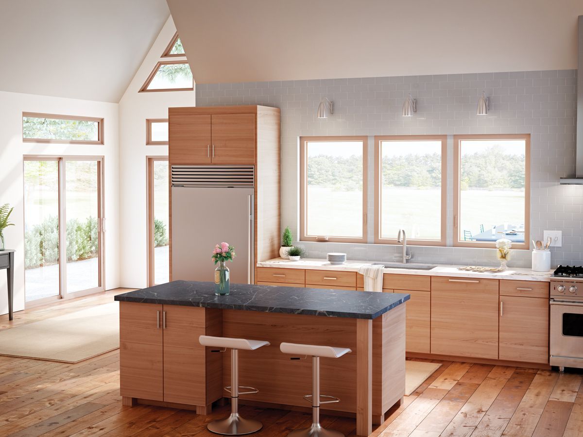 A kitchen with a large island and stools