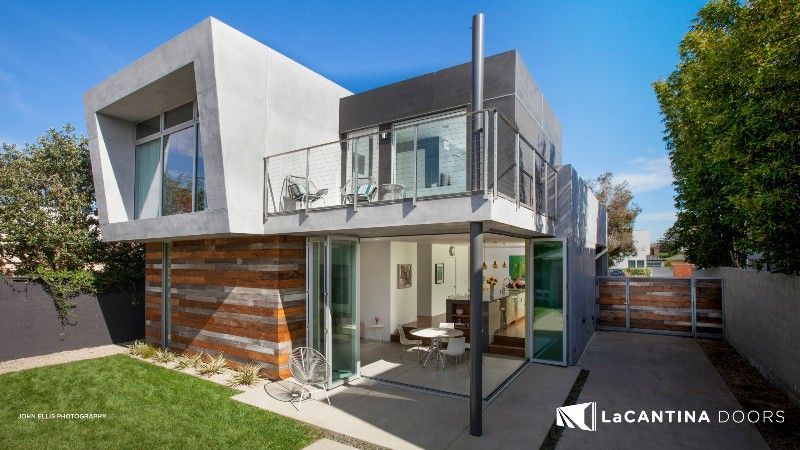 A modern house with a lot of windows and doors