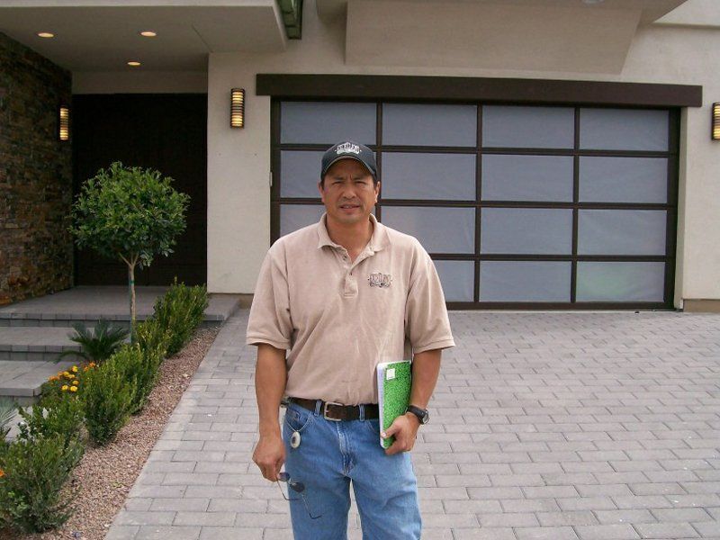 man standing in front of a house