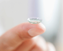 Contact lens on a finger.