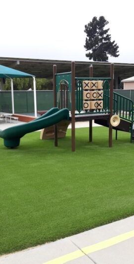 A playground with a slide and a tic tac toe board
