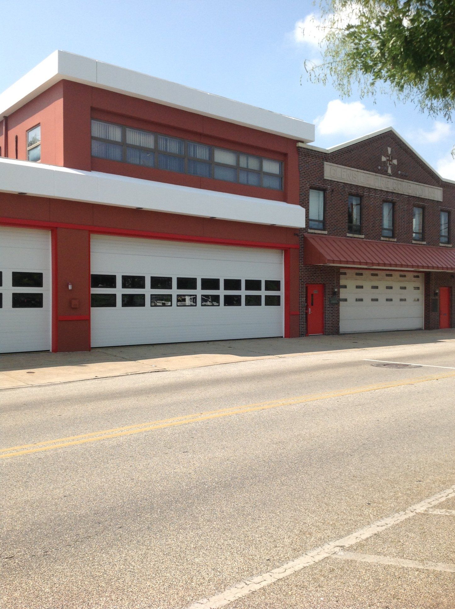 a red and white building with a sign that says fire department